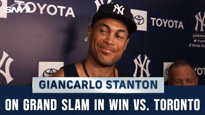 Giancarlo Stanton reacts to his grand slam in the Yankees' win against Toronto